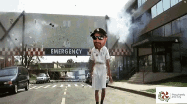 a man is walking in front of an emergency room