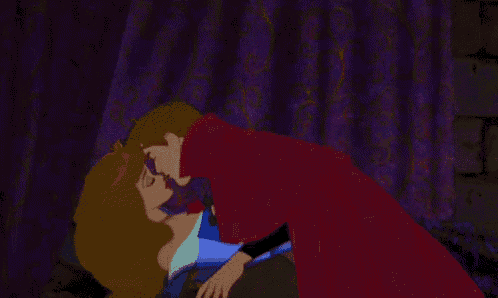 a man and a woman are kissing in a cartoon .