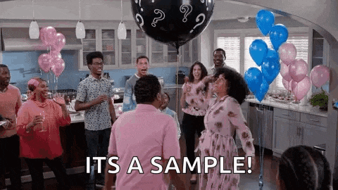 a group of people are dancing at a gender reveal party with balloons and a man holding a balloon .