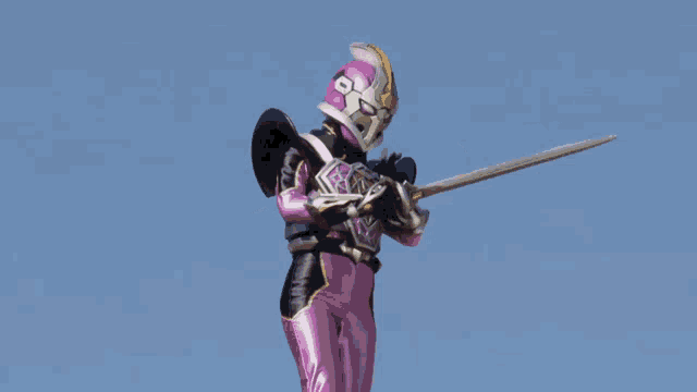 a purple and black superhero holding a sword