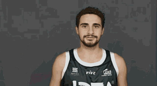 a basketball player wearing a jersey that says vive