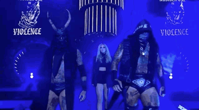 a group of wrestlers are standing in front of a sign that says violence on it