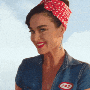a woman wearing a denim shirt with a 143 patch on it
