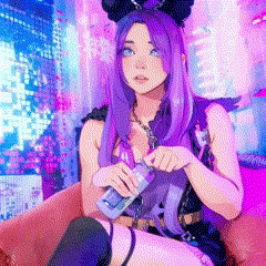 a girl with purple hair is sitting in a chair holding a bottle of liquid .