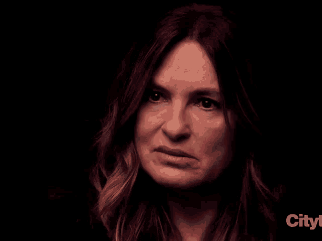 a close up of a woman 's face with the words city in the corner