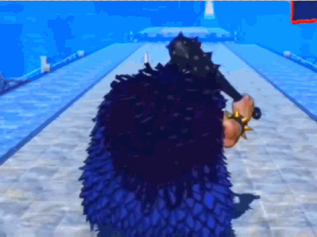 a person in a purple cape is standing on a concrete floor .