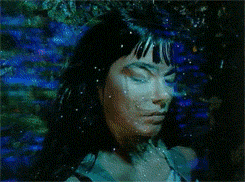 a painting of a woman with her eyes closed and her mouth wide open