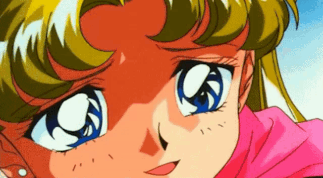 a close up of a girl 's face with blue eyes and a pink scarf .