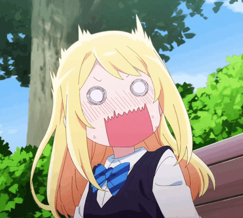 a girl with blonde hair and a blue bow tie making a surprised face