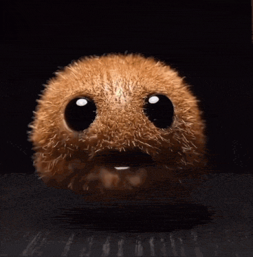 a close up of a kiwi with a face and eyes closed