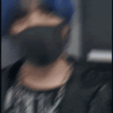 a blurry picture of a man wearing a black mask