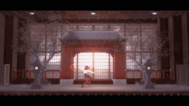 a woman in a red dress is dancing in front of a red door