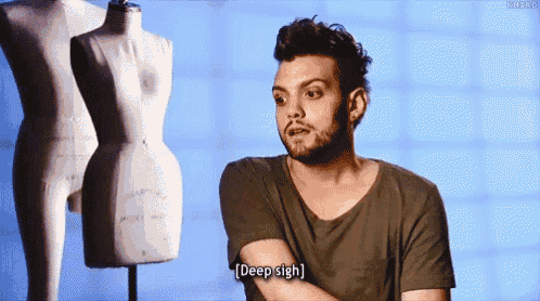 a man with a beard is saying " deep sigh " in front of a mannequin .