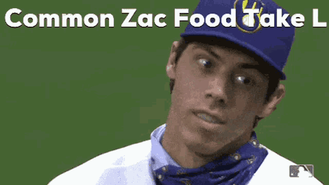 a baseball player wearing a bandana around his neck and a blue hat with the words common zac food take l on it .