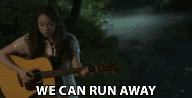 a girl playing a guitar with the words " we can run away " behind her