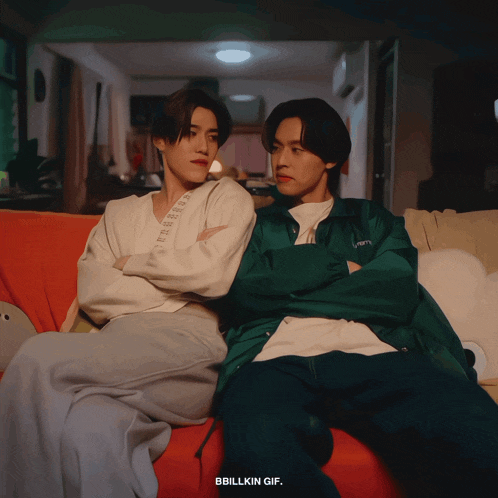two young men are sitting on a couch with their arms crossed and the words bbillkin gif on the bottom