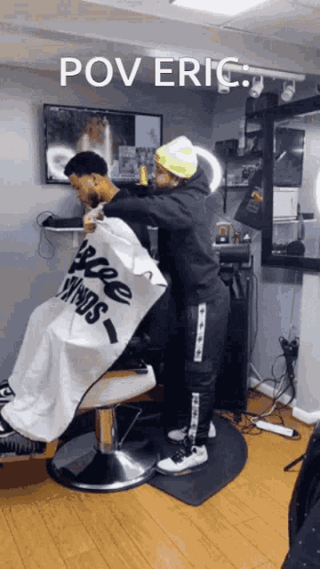 a man is getting his hair cut in a barber shop with the caption pov eric