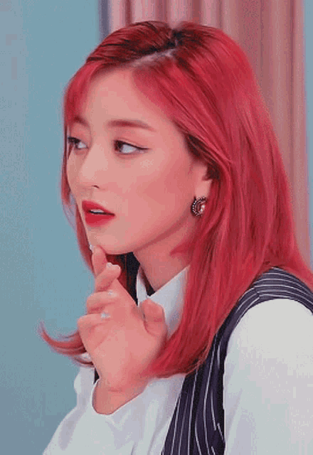 a close up of a woman with red hair