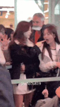 a blurry photo of a group of people with the number 05070819 on the bottom right