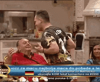 a man with the number 1 on his shirt is talking to another man