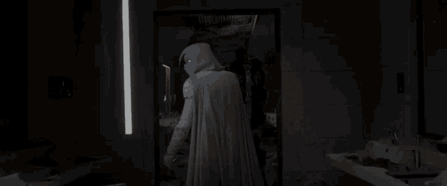 a man with a mask on his face and glowing eyes