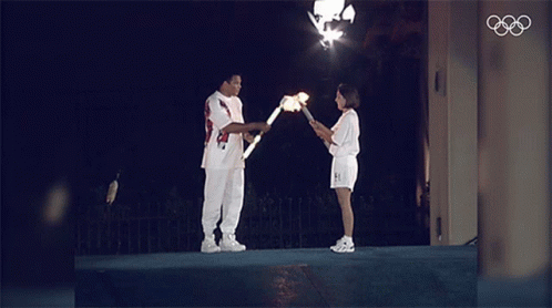 Pass The Flame Muhammad Ali GIF - Pass The Flame Muhammad Ali Olympics GIFs