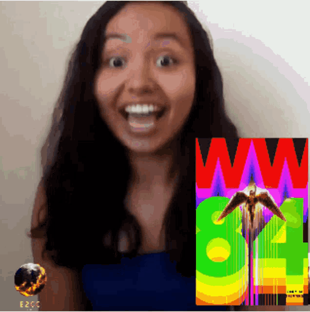 a woman stands in front of a colorful poster that says ww