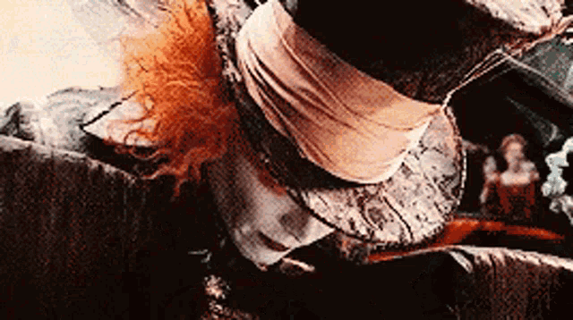 a close up of a mad hatter 's hat with feathers on it