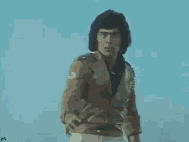 a man is flying through the air with his arm in the air .