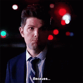a man in a suit and tie says " because "