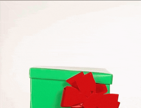 a stuffed animal is peeking out of a green box with a red bow .