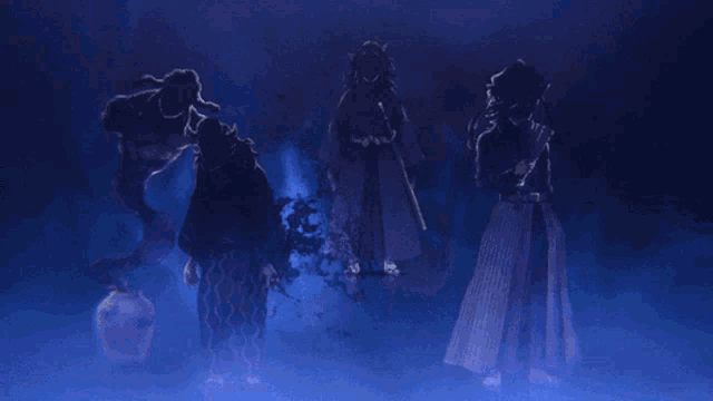a group of people standing in a dark room with blue smoke