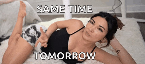 a woman in a black tank top and shorts is laying on the floor with the words same time tomorrow on the bottom .