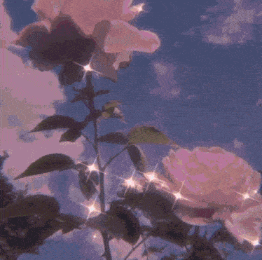 a woman 's face is surrounded by flowers with a purple sky in the background