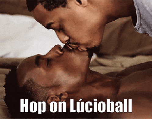 a couple of men kissing with the words hop on lucioball below them