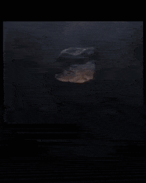 a large rock is being destroyed by a fire