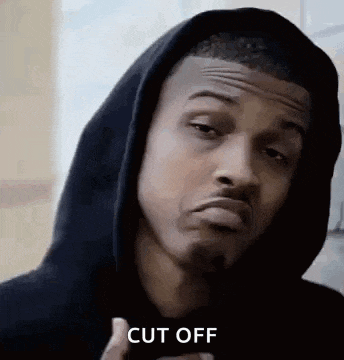 a man in a hoodie is making a funny face and saying cut off .
