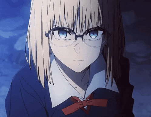 a girl wearing glasses and a bow tie looks at the camera