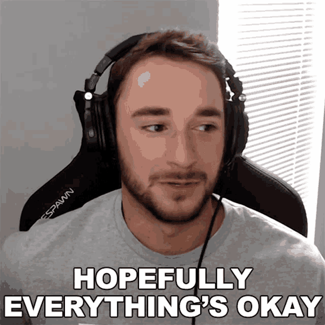 a man wearing headphones with the words hopefully everything 's okay