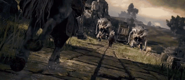 a group of monsters are running down a path in a video game .