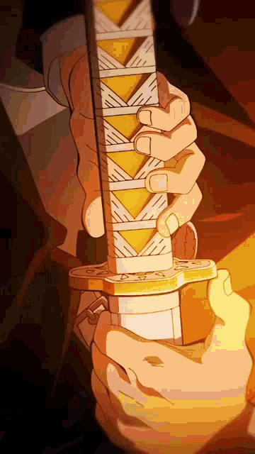a person is holding a sword in their hands with a yellow and white design on it .