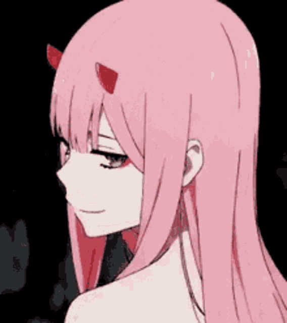 a pink haired anime girl with horns on her head is smiling .