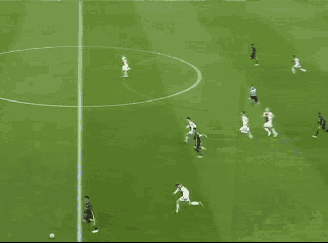a soccer field with pepsi and santander advertisements