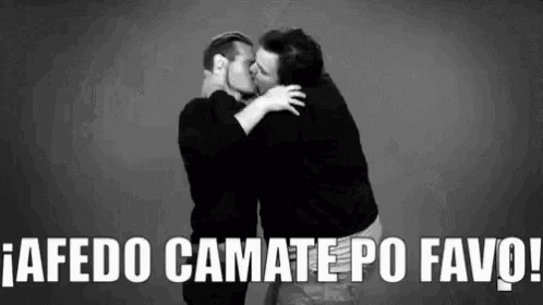 two men are kissing in a black and white photo with the words a fedo camate po favo written below them .
