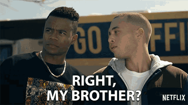 two men are standing in front of a sign that says right my brother on it