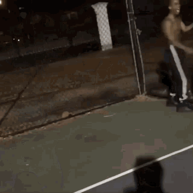 a group of people are standing on a basketball court