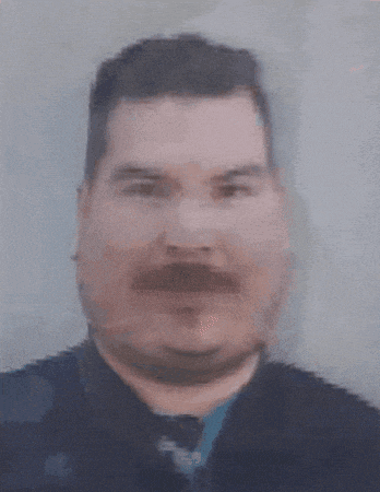 a blurry picture of a man with a beard and mustache