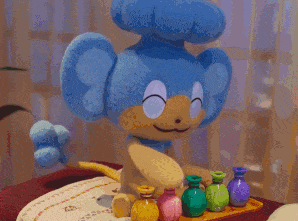 a stuffed animal is sitting on a table with a bunch of bottles