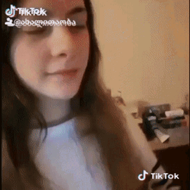 a tiktok video of a woman 's face