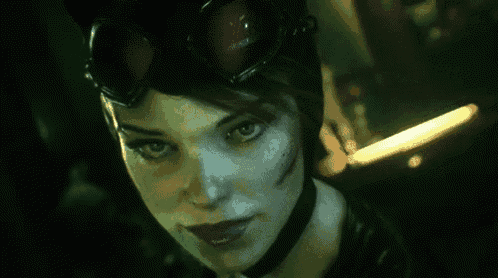 a close up of a woman 's face with a cat woman costume on